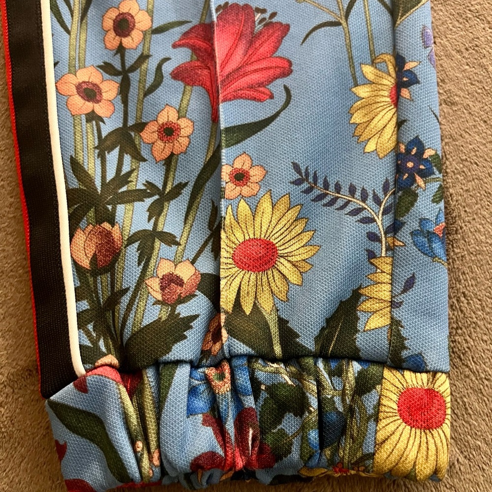 GUCCI  Floral print track pants.